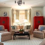 chinese-inspired-coffee-table-ming-red-bookcases-chintz-palm-beach-buffalo-check-curtains-orchids