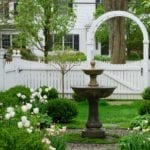 garden-fountain-spring-flowers-tulips-white-picket-fence