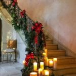 private-newport-staircase-stairs-christmas-greenery-garland-candles-red-bow