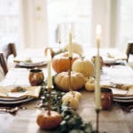 thanksgiving-tablesetting-candles-brass-pumpkins-rustic
