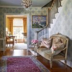 traditional-entry-way-french-settee-antique-persian-rug-staircase