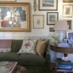 2 gallery-wall-english-style-green-velvet-sofa-chintz-pillow-books-coffee-table