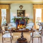 one kings lane_suzanne rheinstein holidays_LIVING ROOM SITTING AREA-chintz-sisal-rug