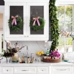 pink-christmas-bows-wreath-white-marble-kitchen