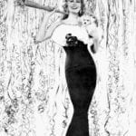 retro-vintage-new-years-eve-party-elegant-lady-holding-dog-streamers-black-and-white-30s-style