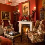 traditional-home-chintz-paintings-persian-rug-christmas-mantel-red-crimson