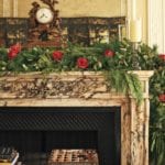 winter-floral-arnagements-veranda-red-roses-garland-elegant-hurricane-candles