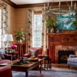 family-room-chintz-grasscloth-wallpaper-pine-paneling-plaid-persian-rug-traditional-classic