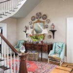 eric-ross-enduring-southern-homes-chinoiserie-fabric-plates-persian-rug-crystal-chandelier-entry-hall-stairs