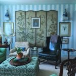 living-room-miles-redd-chinoiserie-screen-leopard-ottoman-botanical-prints-framed