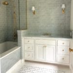 walker-zanger-blue-tile-bathroom-brass-accents