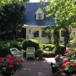 elegant-back-yard-carriage-house-garage-landscaping-dormers-flowers