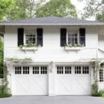 white-house-black-shutters-window-box-pretty-garage-doors