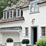 white-painted-house-blue-trim-boxwoods-garage-mac