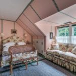 colefax-fowler-old-rose-chintz-attic-bedroom-jeffrey-bilhuber-locust-valley-home-for-sale