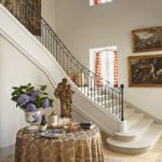 grand-staircase-entrance-hall-skirted-round-table