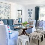 blue-velvet-sofa-fringe-tassel-trim-chinoiserie-wallpaper-panel-framed-living-room-plates-on-wall-clary-bosbyshell-atlanta