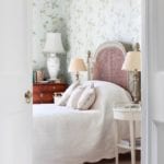 floral-wallpaper-english-bedroom-interior-design-caroline-harrowby-french-cane-headboard-antique