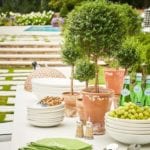 summer-dining-entertaining-outdoors-al-fresco-monogrammed-napkins-topiaries-bamboo-flatware