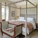 rita-konig-William Yeoward bed vintage quilt Katherine Poole Regency bench Claremont check curtains Nicole Fabre Designs floral