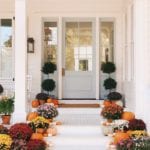 julia-engel-instagram-front-porch-charleston-decorated-for-fall-mums-pumpkins-topiaries