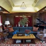 navy-blue-velvet-sofa-persian-rug-baby-grand-piano-traditional-decor