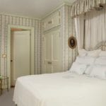 sallie-giordana-park-avenue-apartment-bedroom-monogrammed-linens-canopy-bed