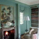 suzanne-rheinstein-library-fireplace-antique-painting-books-Benjamin-Moore-Stratton-Blue-paint