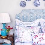 clary-bosbyshell-atlanta-interior-design-blue-white-chinoiserie-plates-handing-on-the-wall-d-porthault-floral-linens