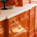 christopher-peacock-orange-lacquered-kitchen-cabinets-marble