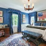 dan-carithers-boys-traditional-masculine-bedroom-american-flag-americana-patriotic-persian-rug-brown-furniture-antiques-classic-timeless-preppy