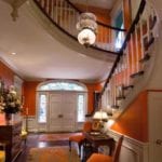 lee-robinson-kentucky-interior-designer-southern-style-grand-entrance-hall-entry-decor-stairs-staircase-orange-painted-walls-persian-rugs