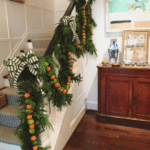 cathy-kincaid-interior-design-holiday-christmas-garland-with-fresh-fruit-oranges-limes-stairs-staircase-entry-foyer