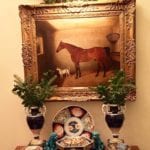 holly-berries-sprigs-decorate-for-christmas-above-oil-portraits