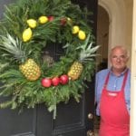 patricia-altschul-michael-butler-front-door-williamsburg-colonial-inspired-christmas-holiday-wreath-evergreen-pineapples-lemons-apples