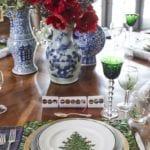 Flower-Christmas-Table-Setting-classic-holiday-decor-blue-white-ginger-jars-christmas-tree-spode-dinner-plates-wine-glasses