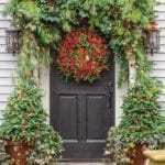 Front_Door_Winter_Holiday_Decor-Christmas-garland-trees-pinecones-flower-magazineWashington, D.C., event planners Rick Davis and Christopher Vazquez