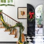 christmas-entrance-black-lacquered-door-marble-floors-stairs-staircase-garland-southern-home-traditional-christmas