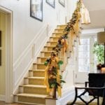 christmas-holiday-banister-stairs-staircase-decorating-ideas-traditional-home-classic-style-garland-lemons-citrus-ribbons-pinecones-fresh-chippendale-chairs-classic-southern-home