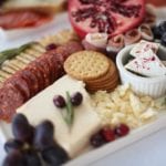 christmas-holiday-cheese-board-salami-crackers-peppermint-bark-cranberries