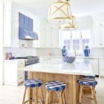 caitlin-wilson-blue-star-range-french-barstools-marble-countertops