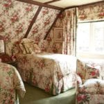 rose-cumming-chintz-floral-enveloped-guest-room-attic-upholstered-walls