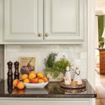 Minnette Jackson kitchen marble backsplash black granite unlacquered cabinet knobs sage green