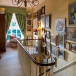 english-country-style-paula-sutton-hill-house-vintage-gallery-wall-art-stairs-landing