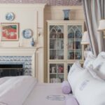 cathy-kincaid-bedroom-leontine-linens-monogram-pillows-delft-tile-fireplace-bedroom