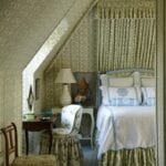cathy-kincaid-sister-parish-dolly-upholstered-walls-matching-canopy-bed-attic-bedroom-bedding-chair-bowood-chintz-leontine-monogramed-linens