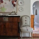 nicola-bathie-mclaughlin-home-tour-abstract-art-chintz-chair-amy-berry-antiques