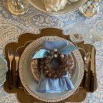 serena-fresson-holiday-fall-tablescape-tortoise-flatware-blue-white-brown-feather-wreath