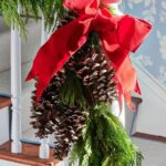 southern-living-christmas-lanvin-label-banister-fresh-evergreens-red-ribbon-bows