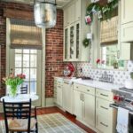 southern-living-christmas-lanvin-label-kitchen-holiday-decorated-green-cabinets-blue-white-tile
